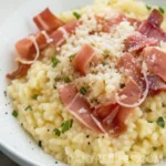 Best Pastina with Prosciutto Recipe 16 Creamy bowl of Pastina with Prosciutto topped with grated parmesan and fresh herbs