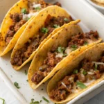 Crispy baked tacos filled with seasoned ground beef and melted cheese.