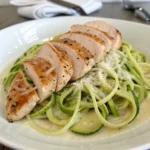 Zucchini noodle chicken alfredo with sliced grilled chicken breast.